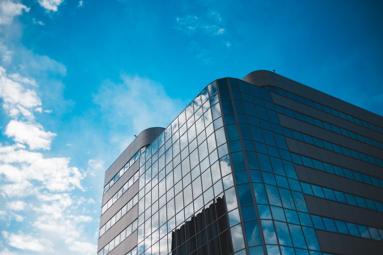 Crafting Captivating Headlines: Your awesome post title goes here From below of contemporary house exterior under blue sky with shiny fluffy clouds in town